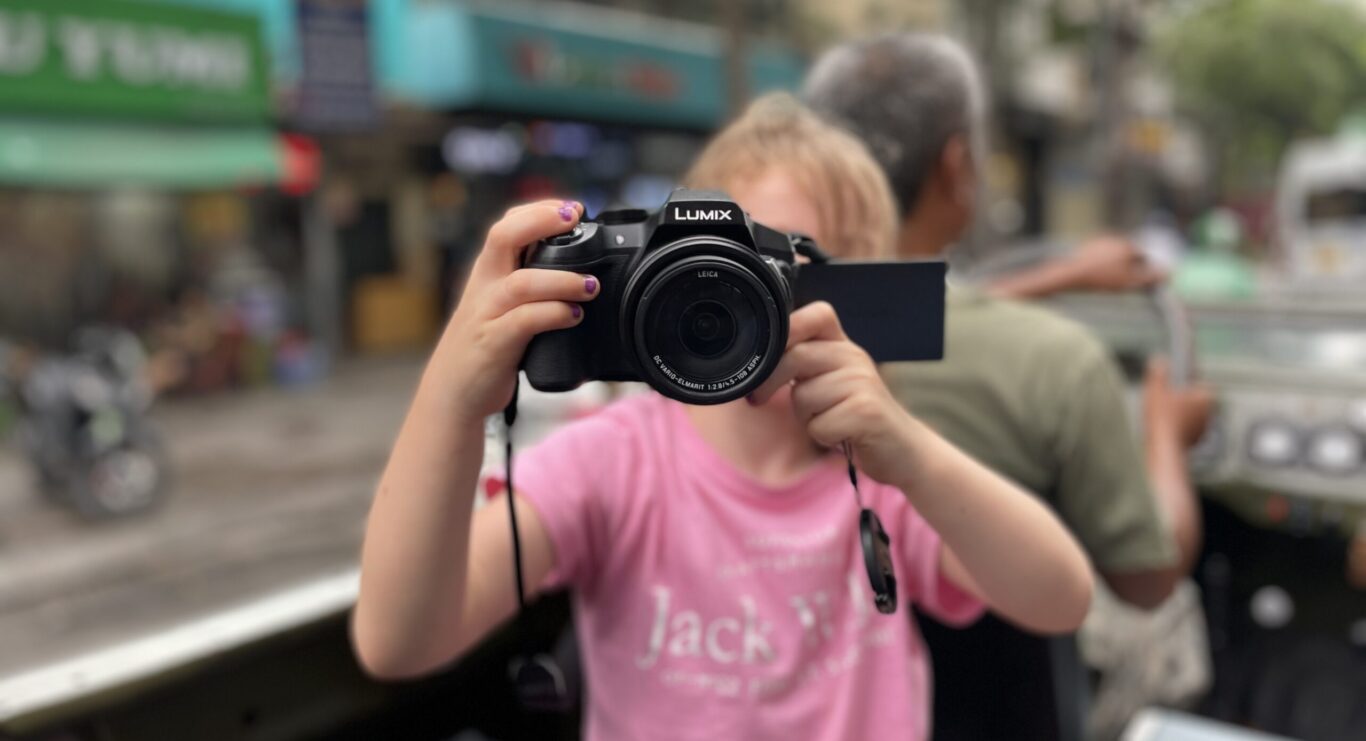 Girl with camera on family-friendly adventure